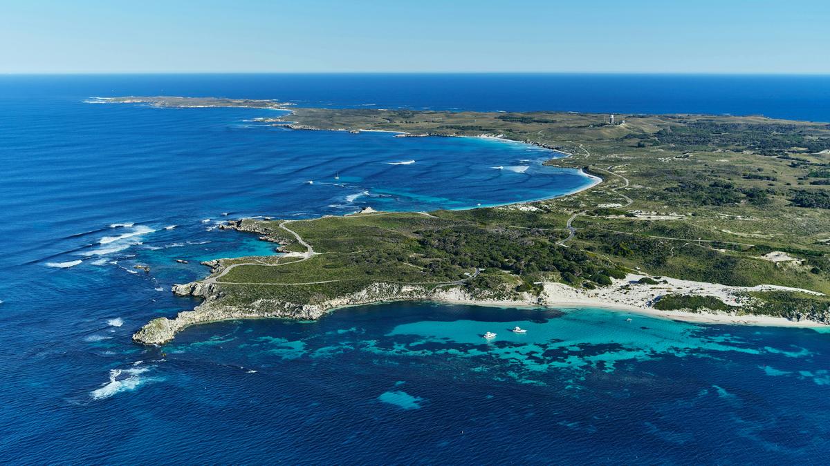 Aerial view of island landscape with beaches, headlands.