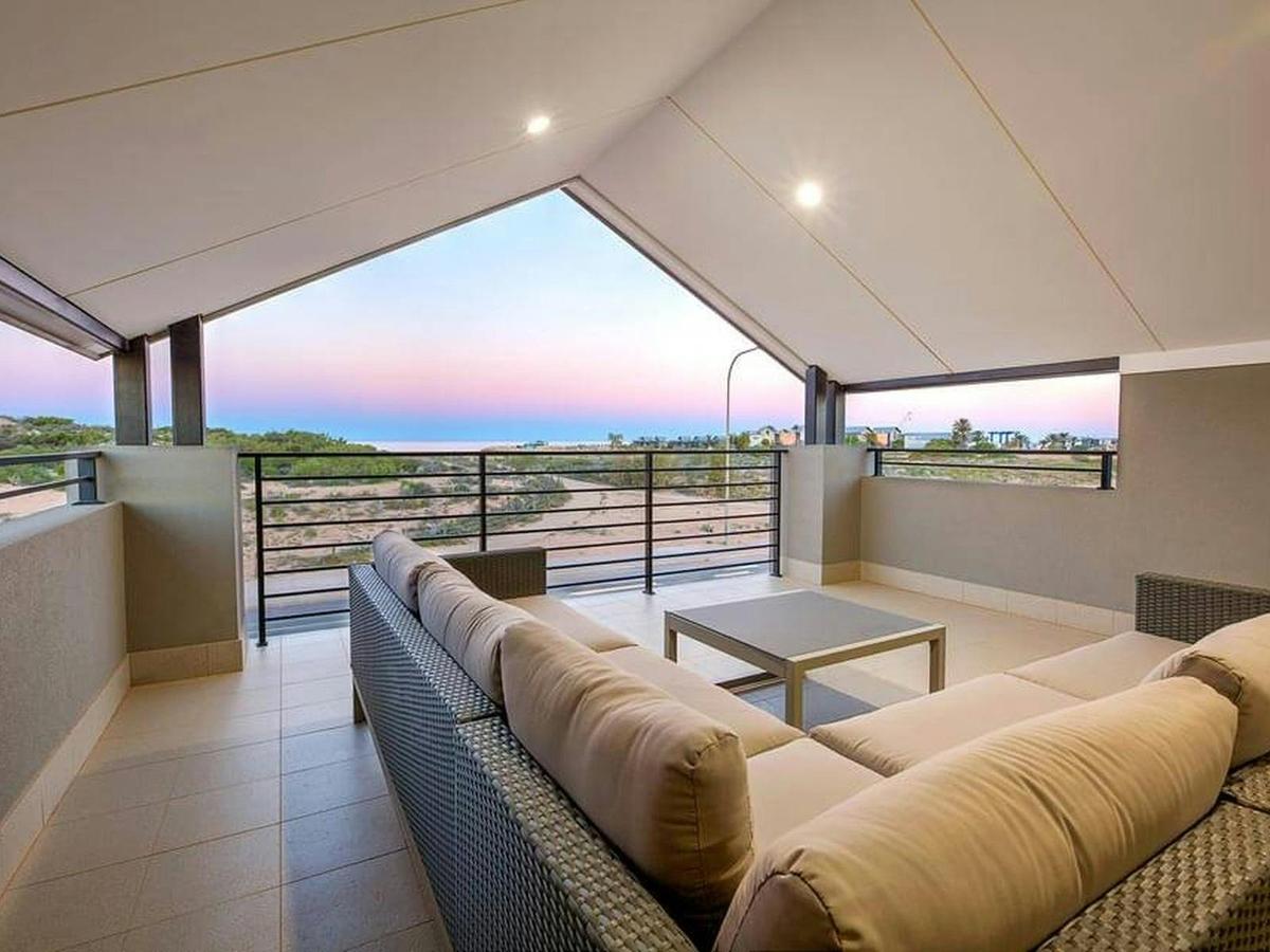 Relax on the upstairs balcony and soak up breathtaking ocean views from sunrise to sunset.