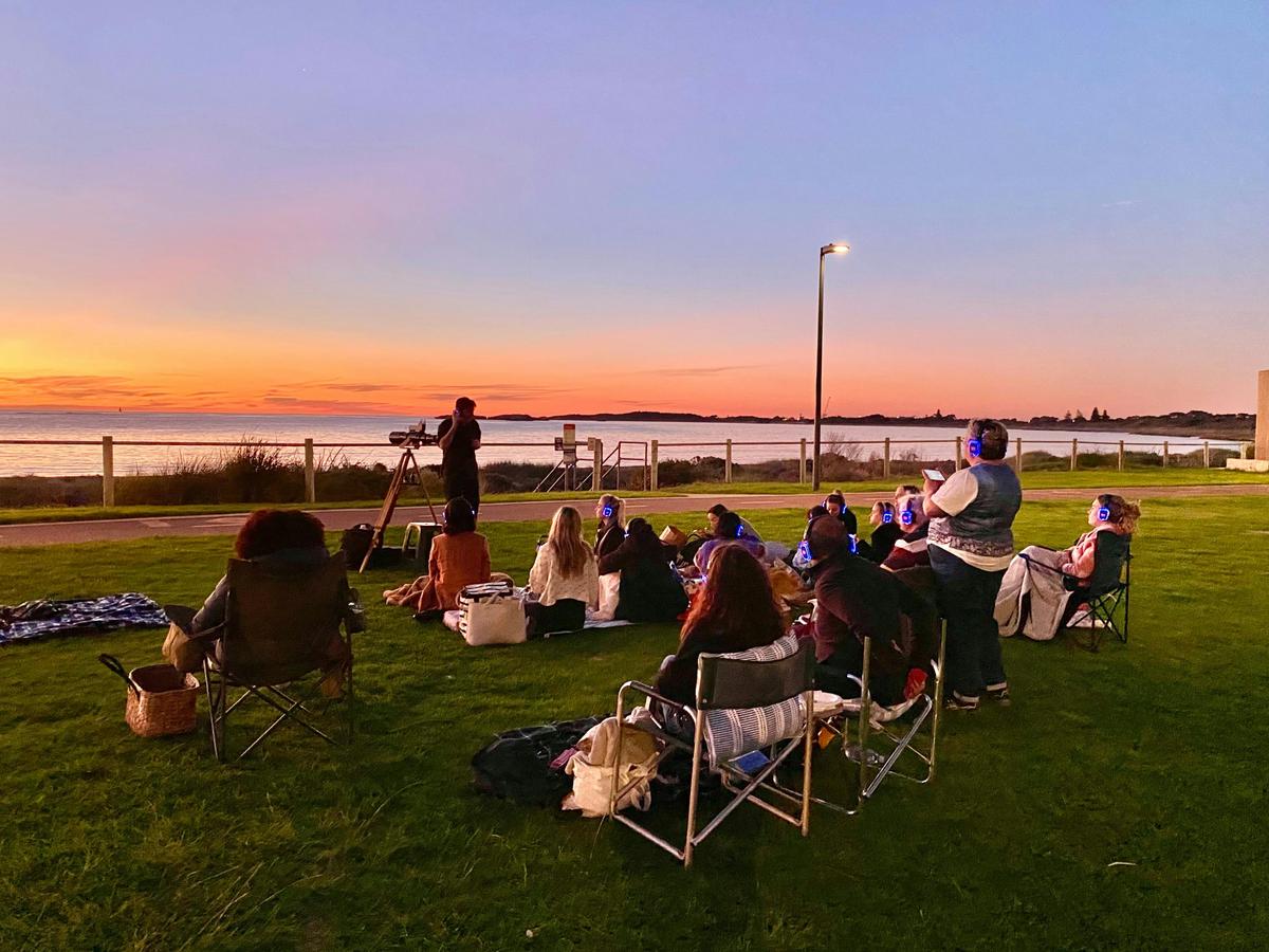 Astro Tour guide with group on the foreshore