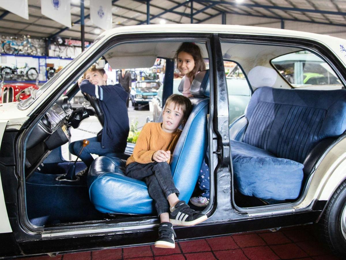 Children sitting and playing inside a Leyland Marina