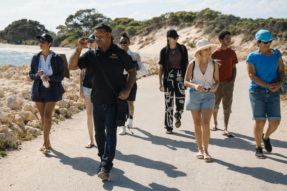 Steven Jacobs leads a group of tourists on Point Peron