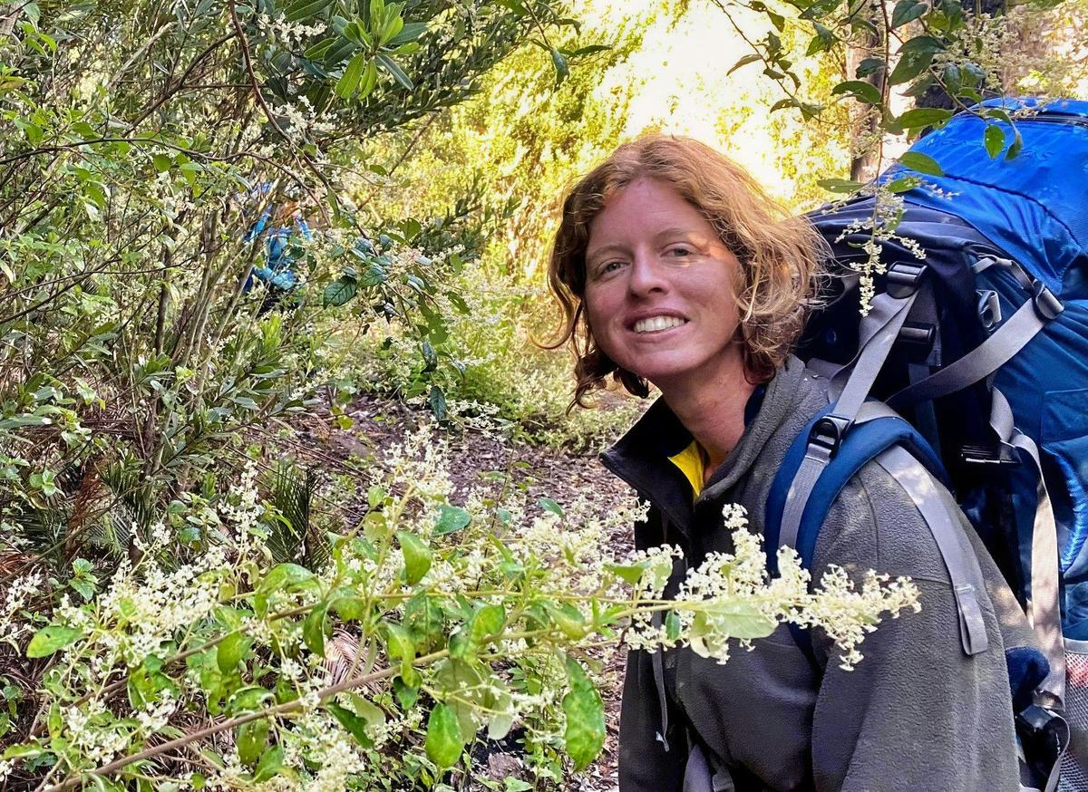 Woman hiking with a large backpack on the bibbulmun track
