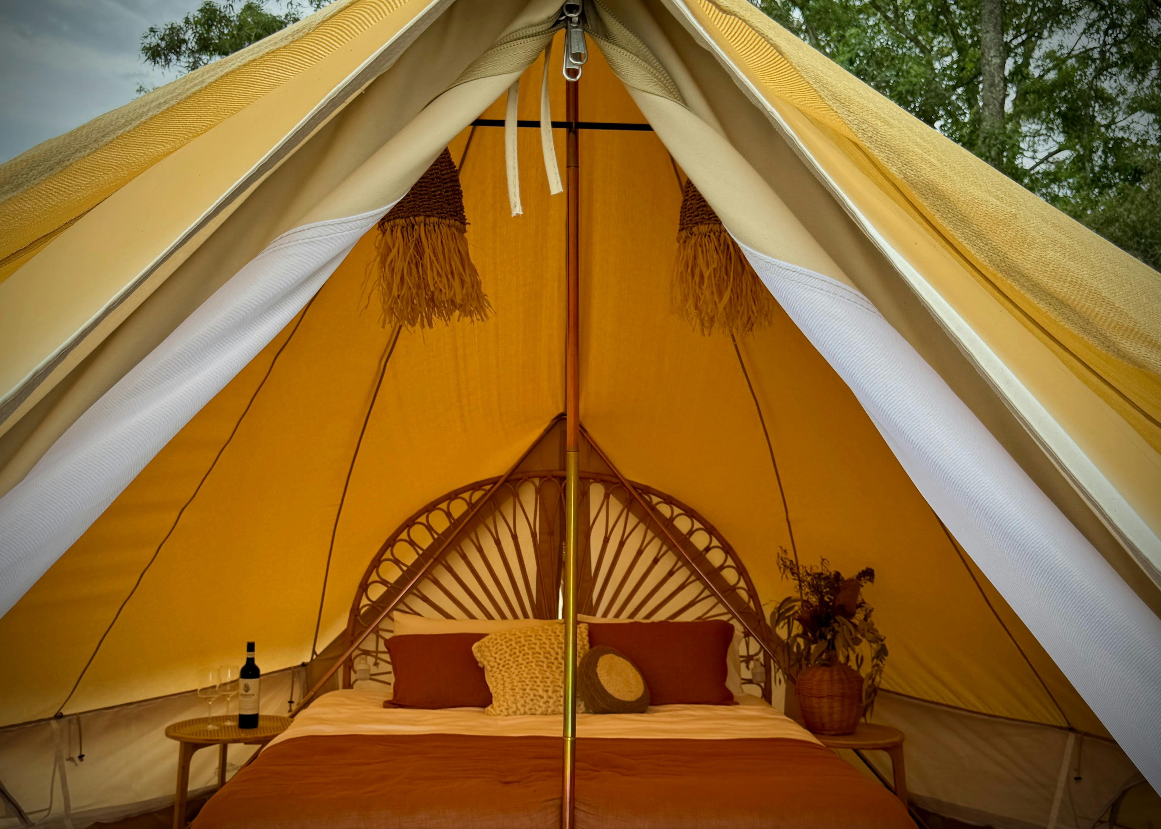 Luxurious full height king size bed in glamping tent