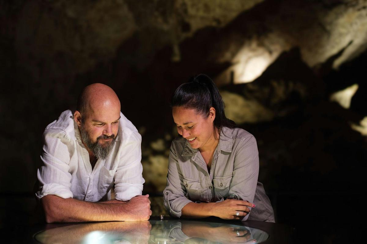 See ancient fossil remains in displays, and embedded in the cave wall.