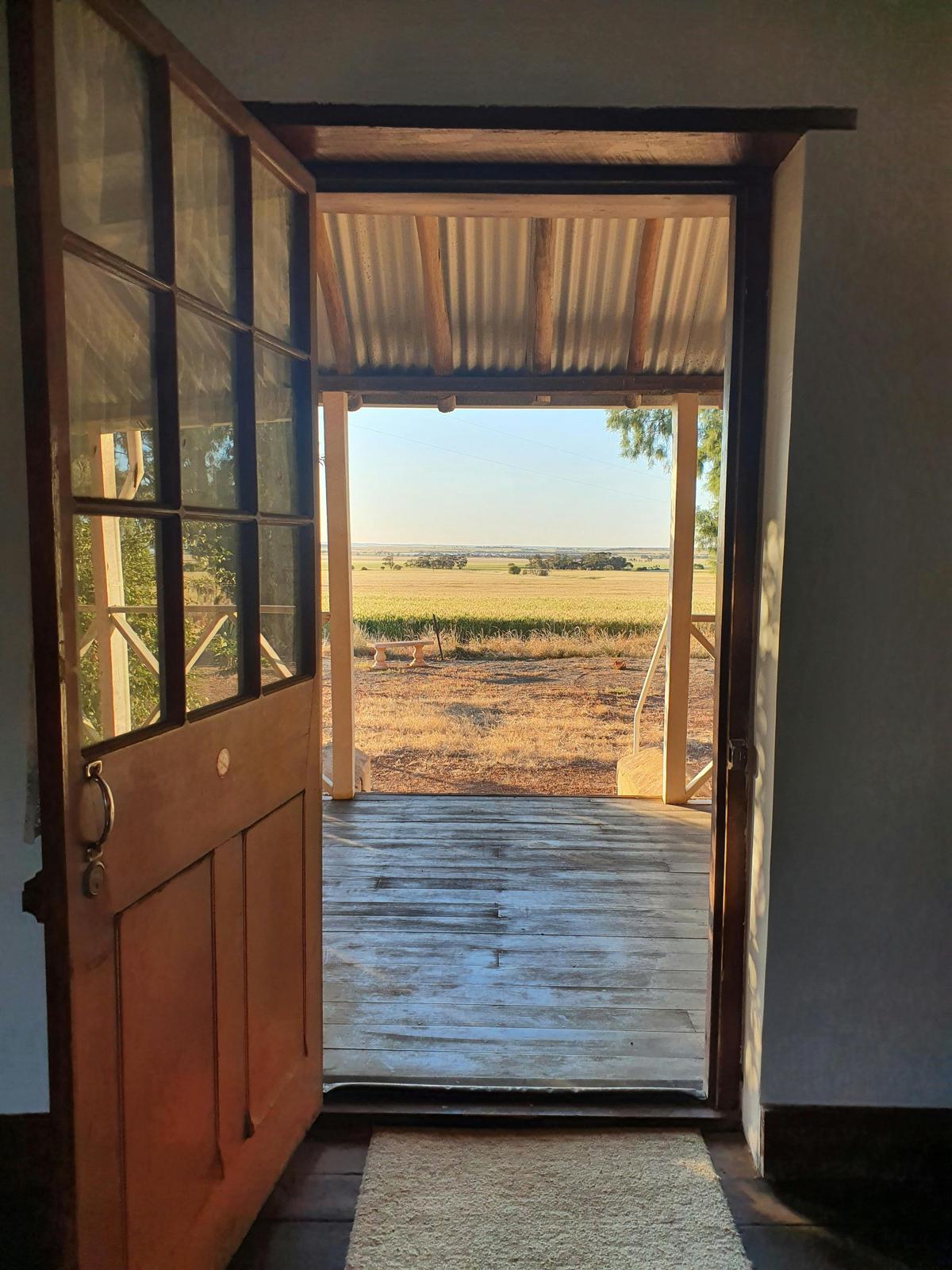 Looking out across the veranda at the Macpherson Homestead in Carnamah