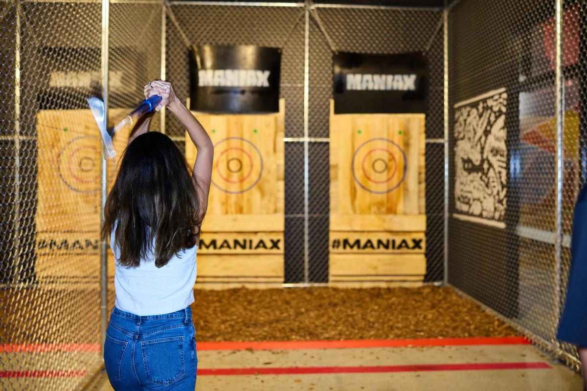 Woman throwing an axe at a target