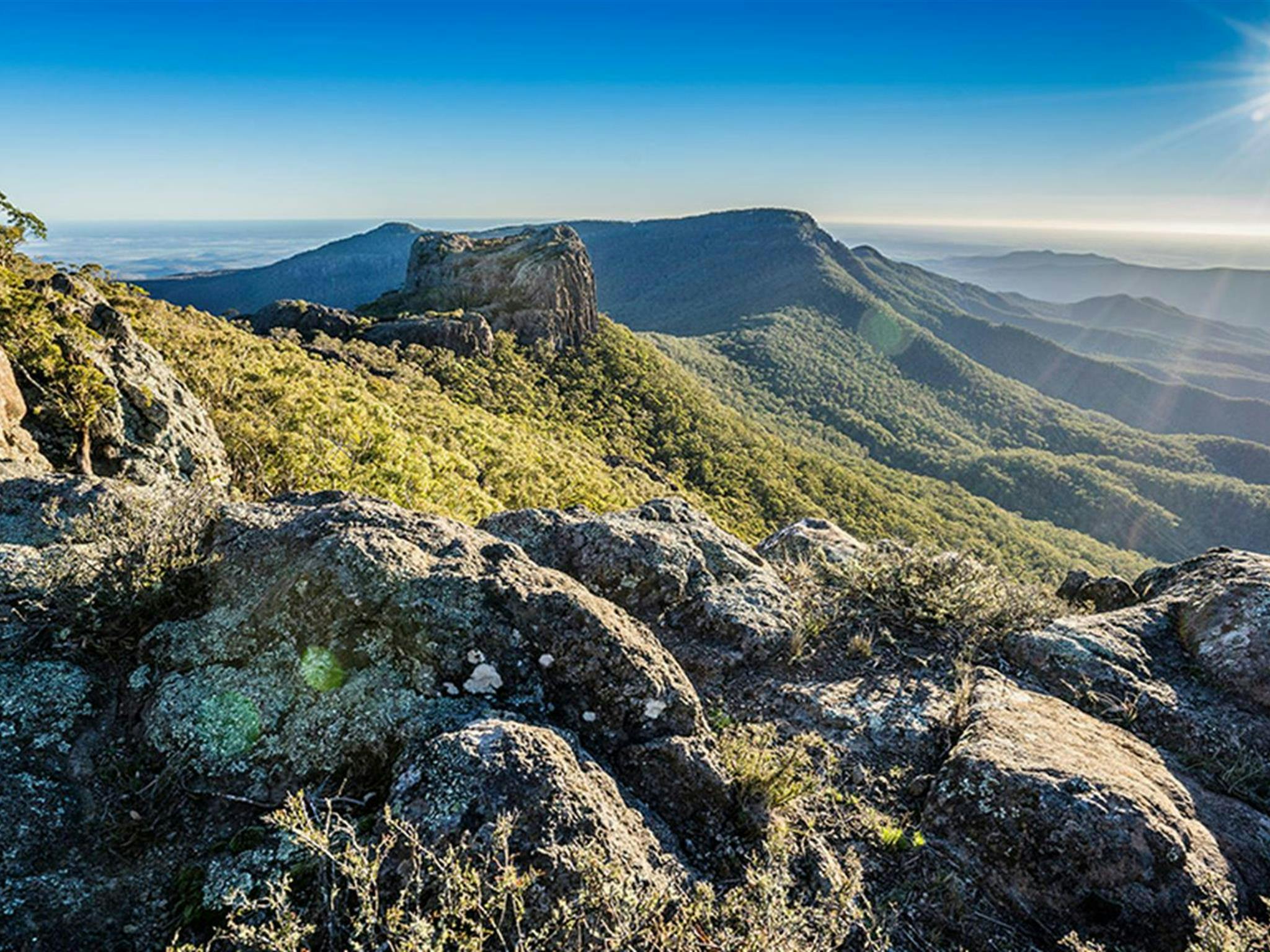 View of rugged ridges and distant valleys in Mount Kaputar National Park. Photo Credit: Simone