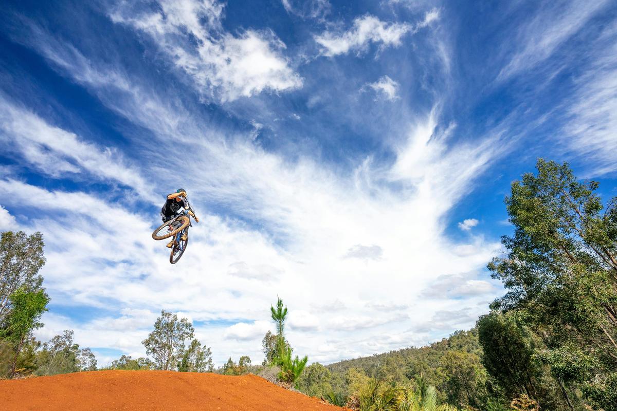 Getting air on Murray Valley Mountain Bike Trails in Dwellingup, Western Australia