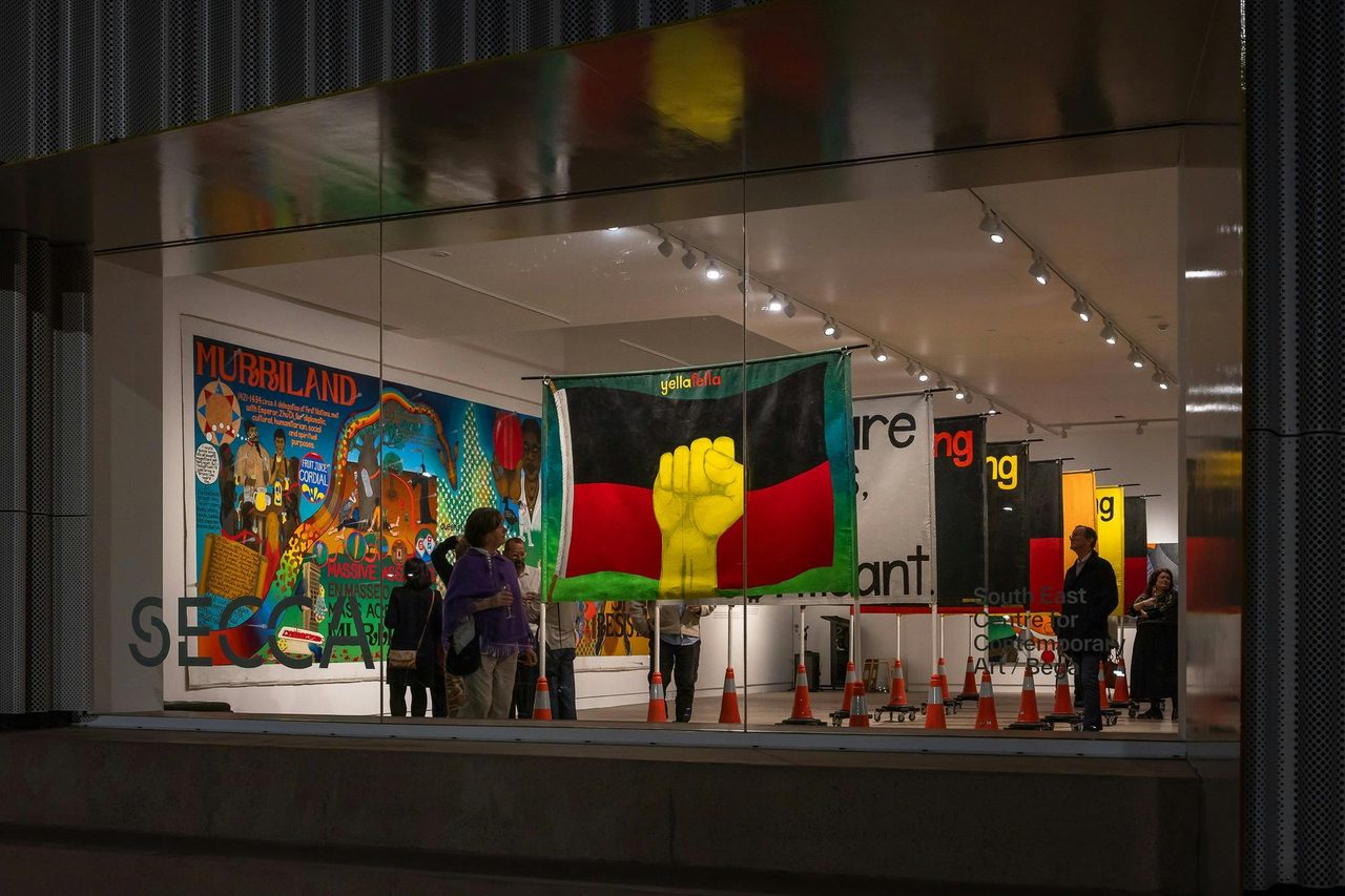 SECCA night window view of Gordon Hookey exhibition A MURRIALITY on tour from IMA and UNSW Galleries