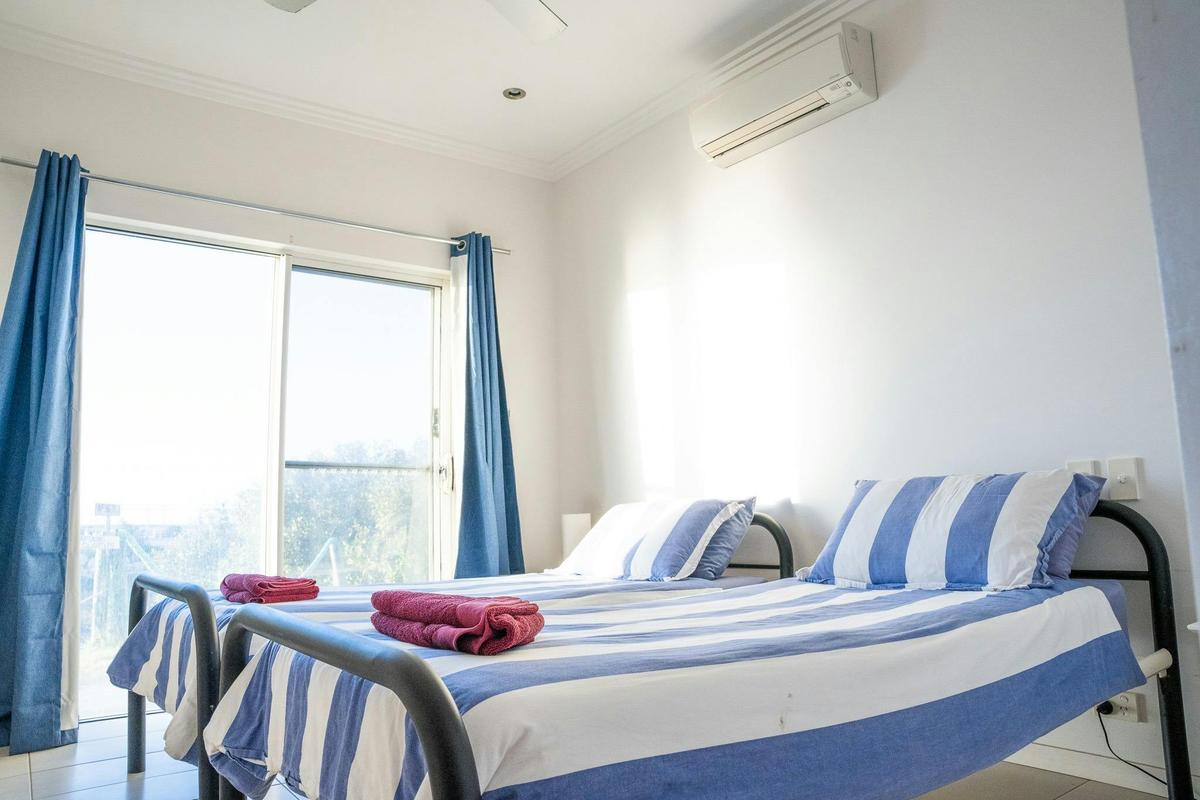 Villa bedroom with two single beds