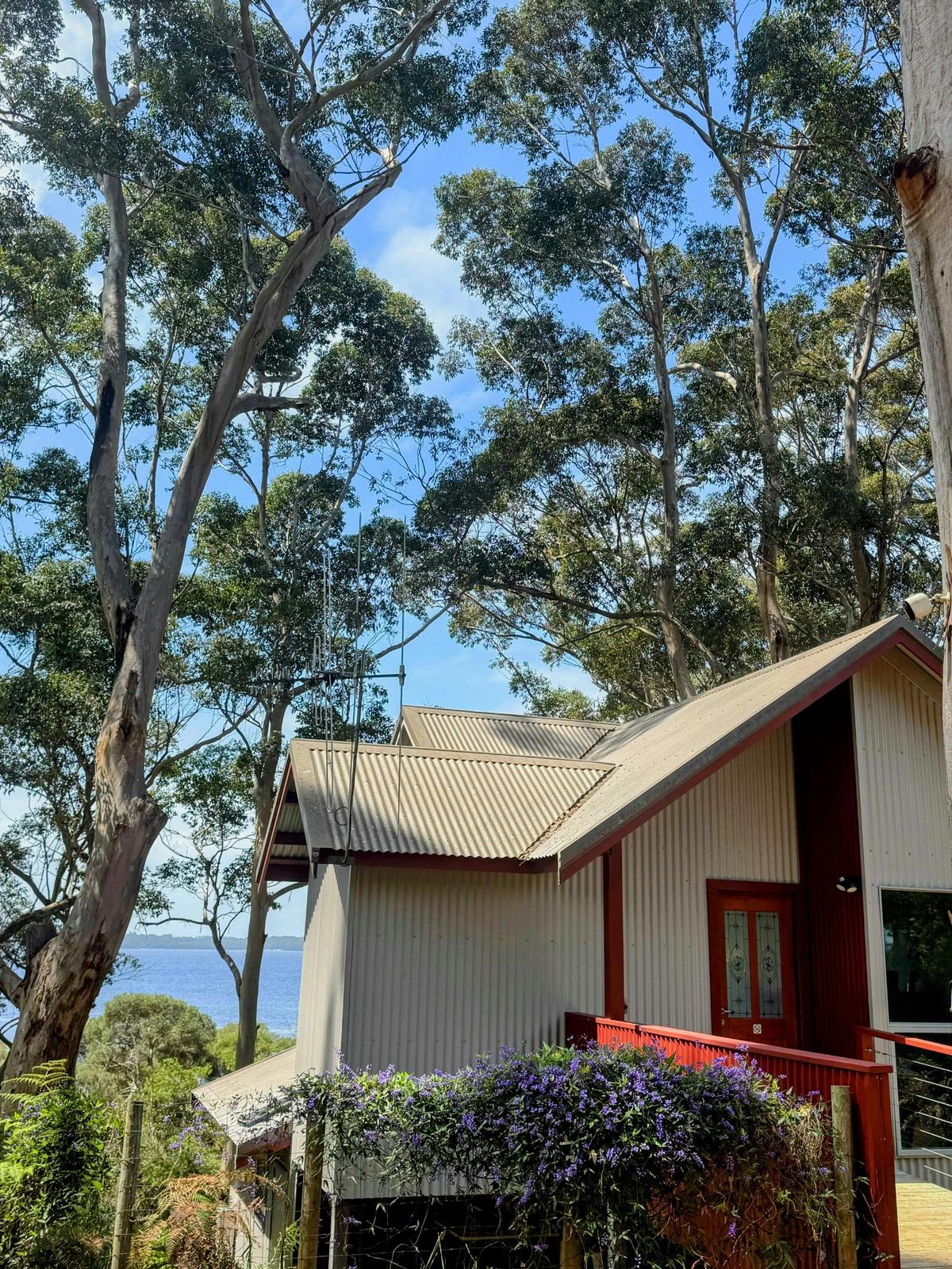 Chalet entrance with views of Wilson Inlet and surrounding karri trees.