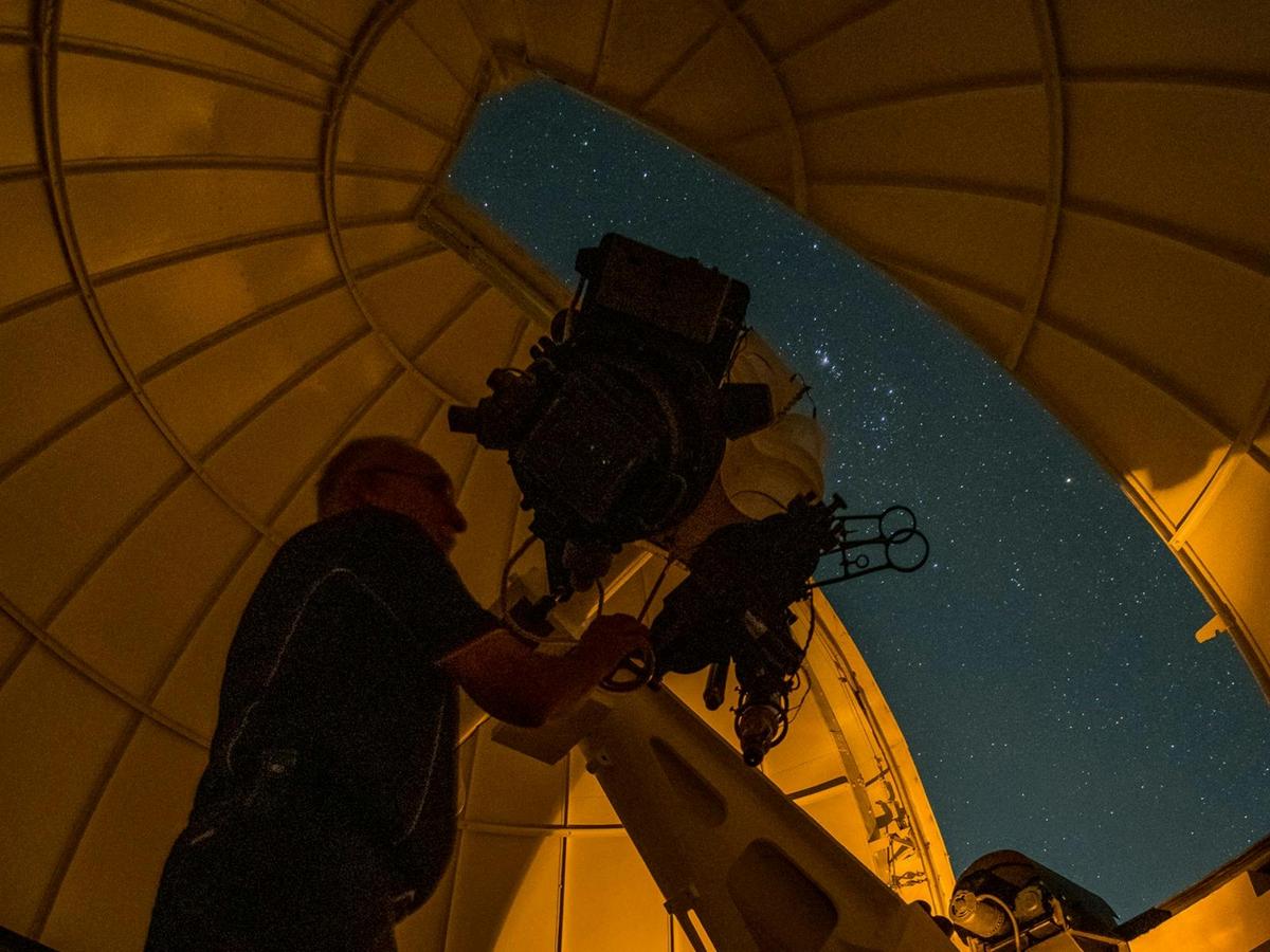 Volunteer Lloyd moving the Astrographic Telescope