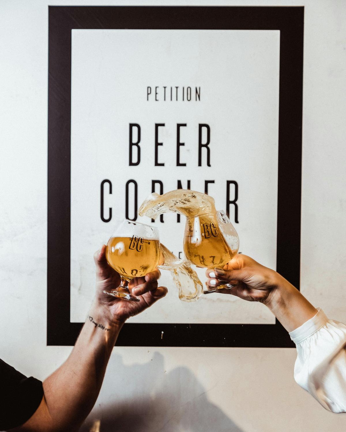 Two beers and beer corner sign