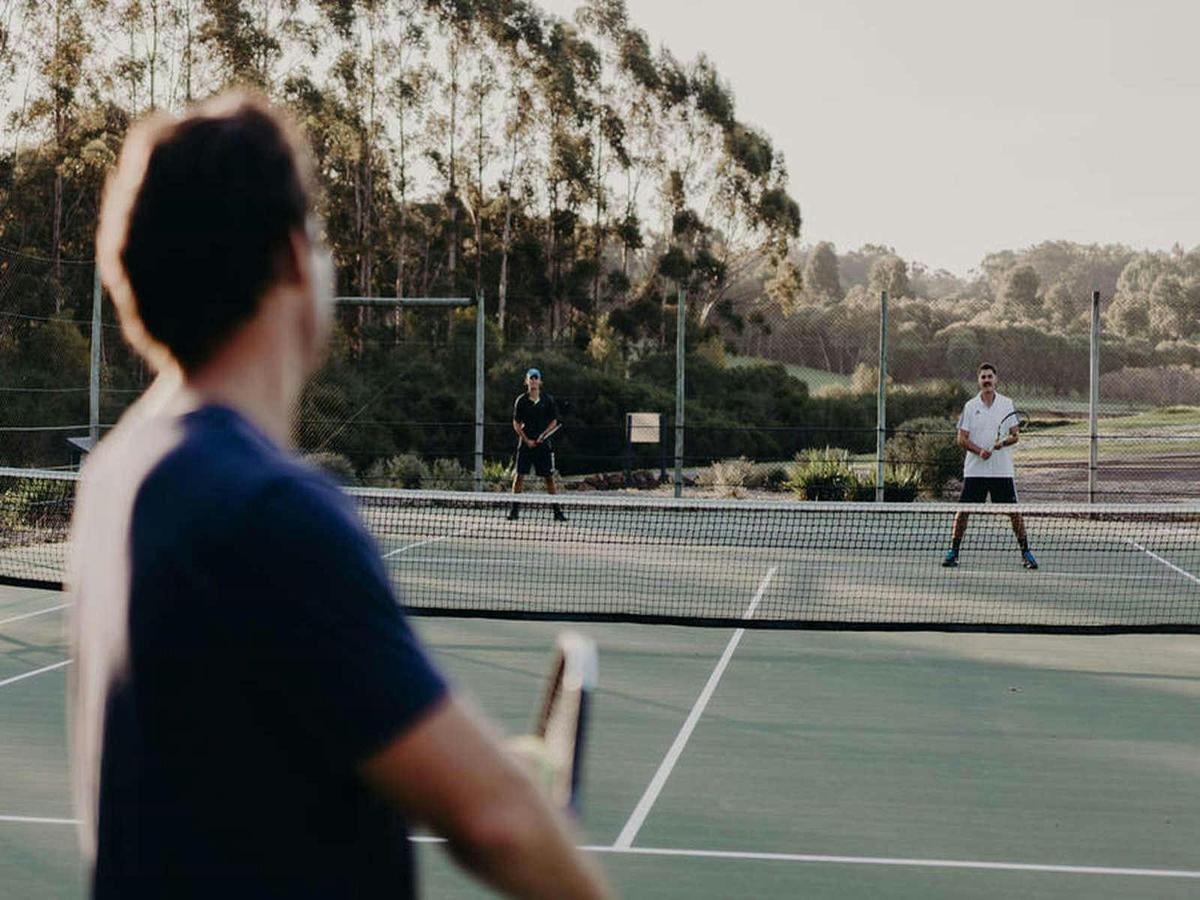 Enjoying the tennis courts at Tanah Marah