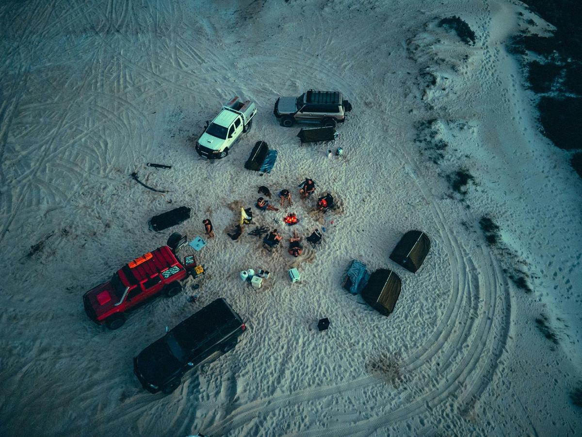 Aerial view of group camping on beach