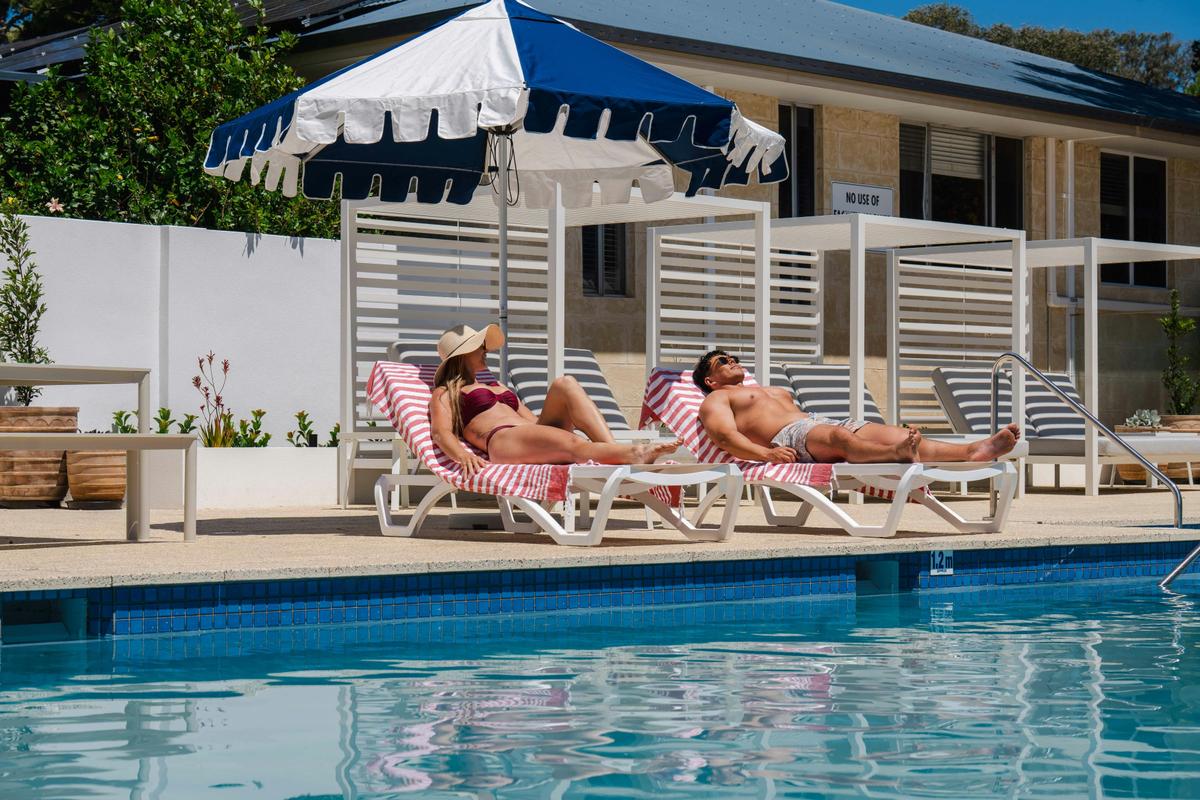 man and woman at the swimming pool