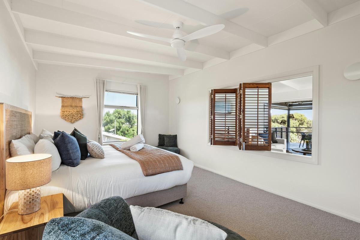 Bedroom 1 – 1 King Bed – Upstairs, with ceiling fan, ensuite bathroom, and walk-in wardrobe
