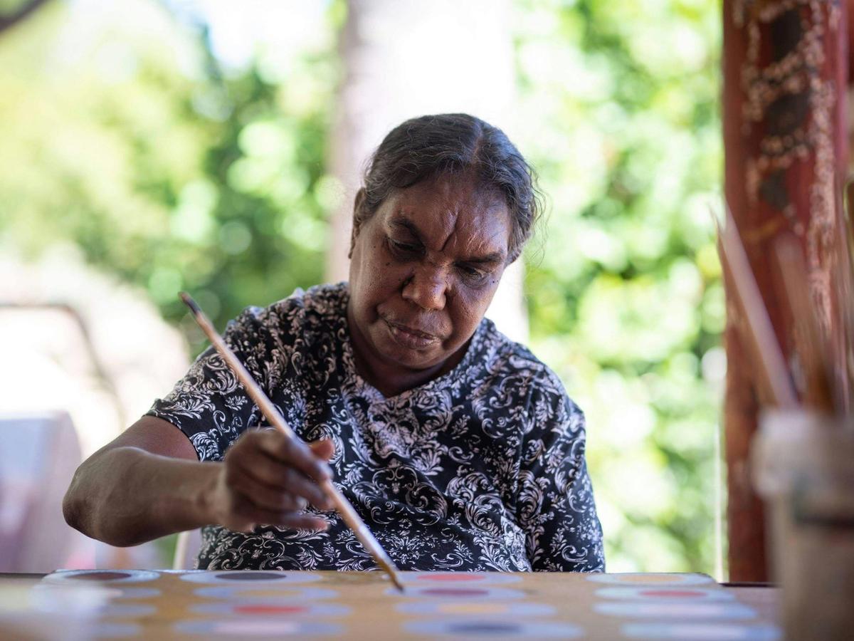 Artist Brenda Ningarmara painting at Waringarri Arts
