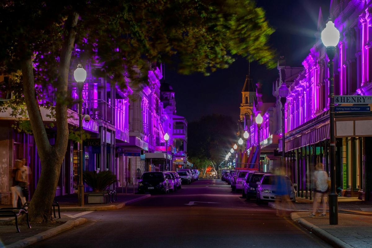 View down High Street West End at night
