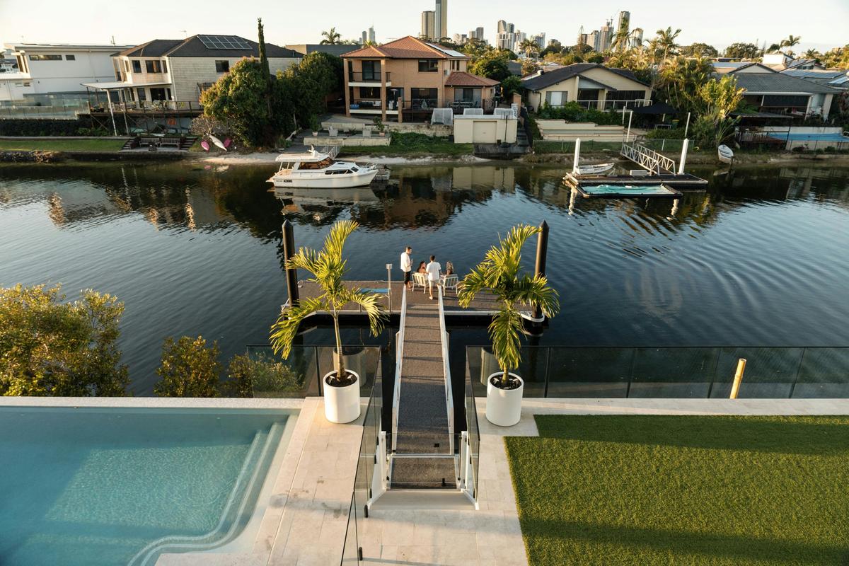 The pool, gangway and private pontoon on the canal, golden hour