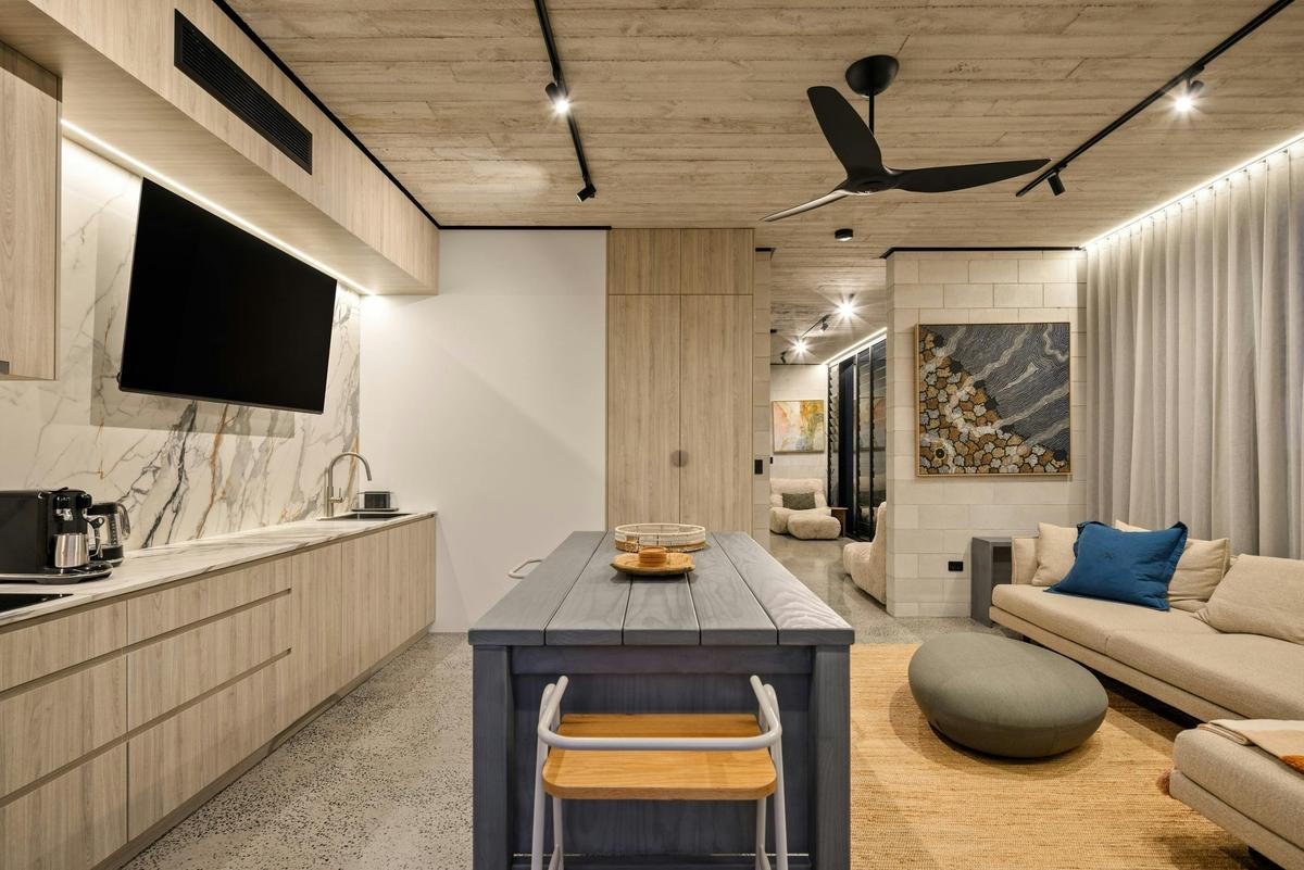 A second living level with its own kitchenette, opening to the canal deck