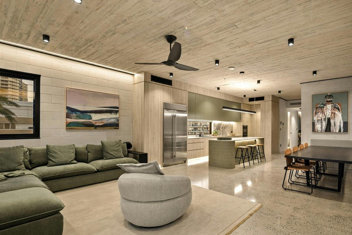 One open level holds the lounge, the island and the dining table