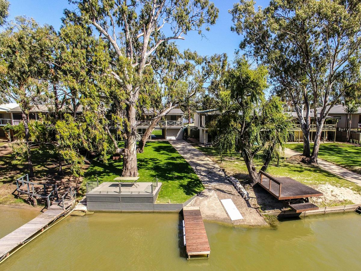 River frontage with jetty and balcony