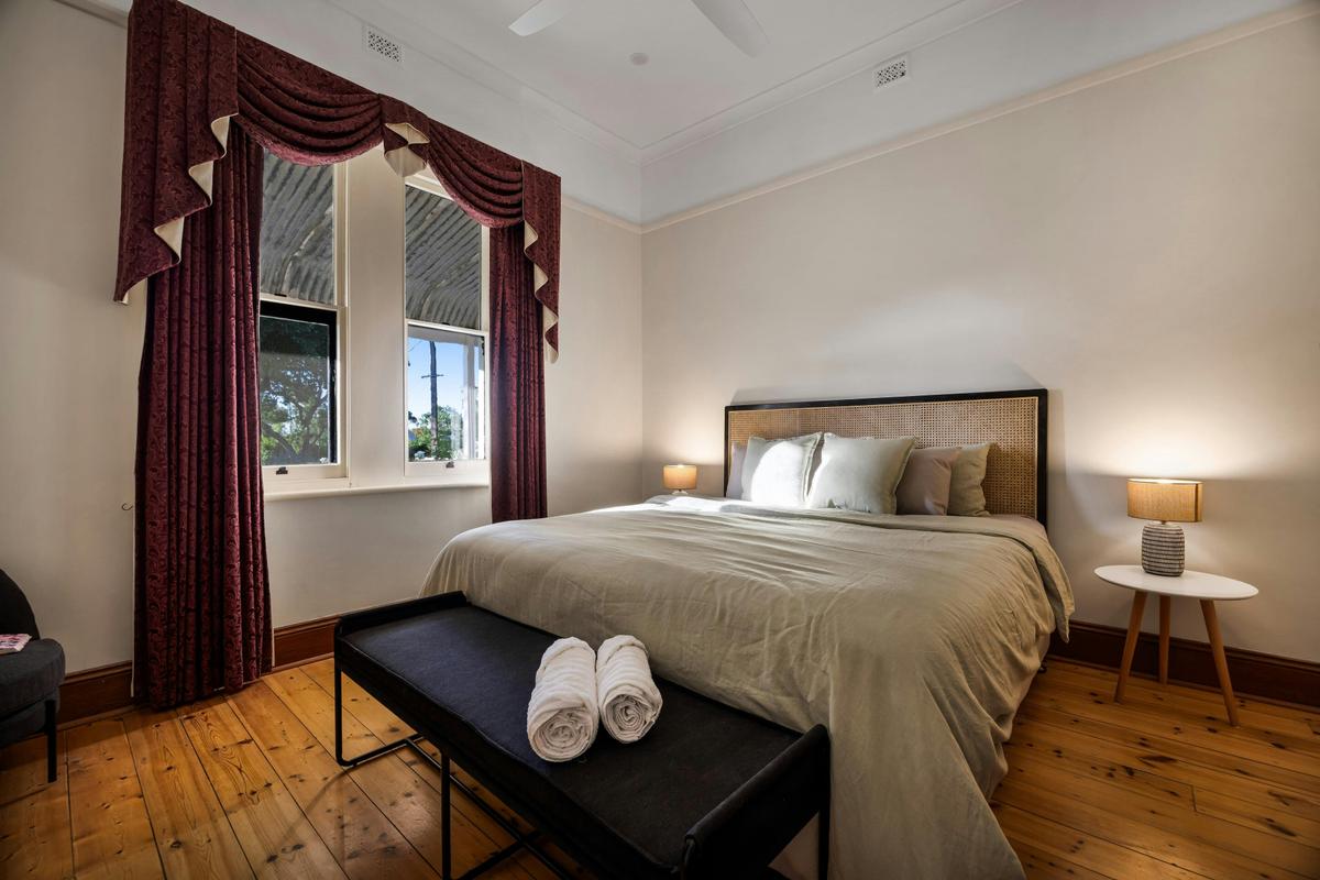 This king-size bedroom offers complete privacy and comfort.