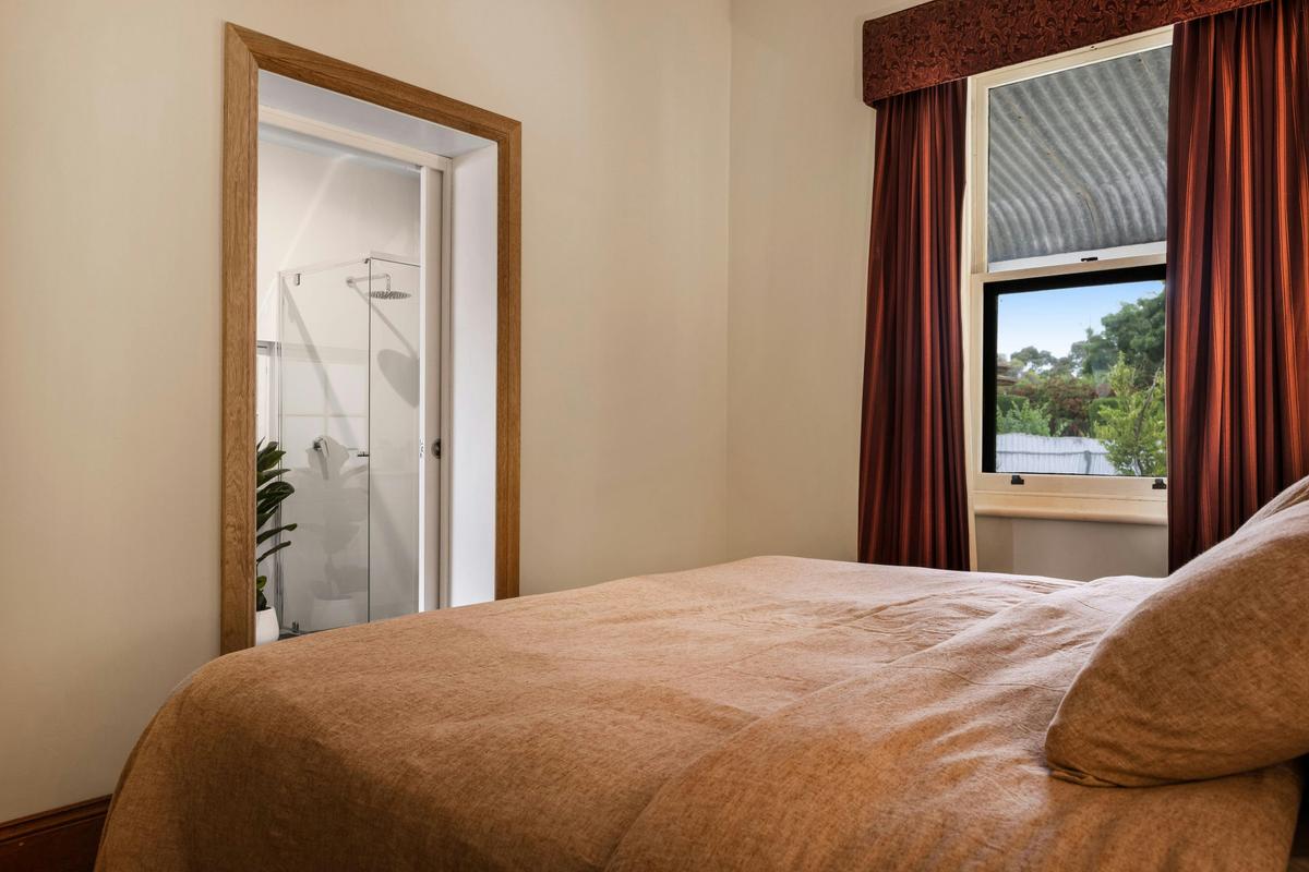 This king-size bedroom features a contemporary new ensuite bathroom.