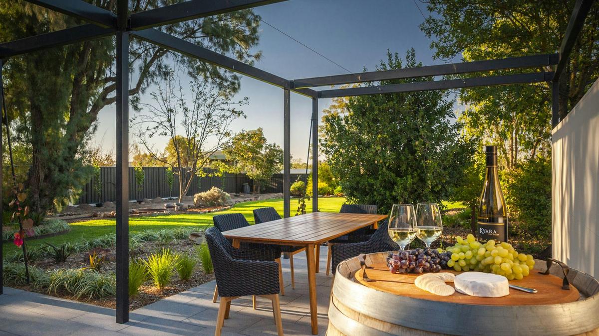 Alfresco area for outdoor drinks and a BBQ looking at the garden and big blue skies