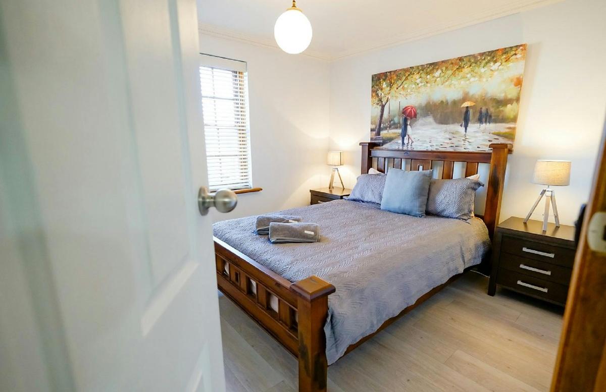 Second bedroom with queensize bed; wardrobes; luggage racks