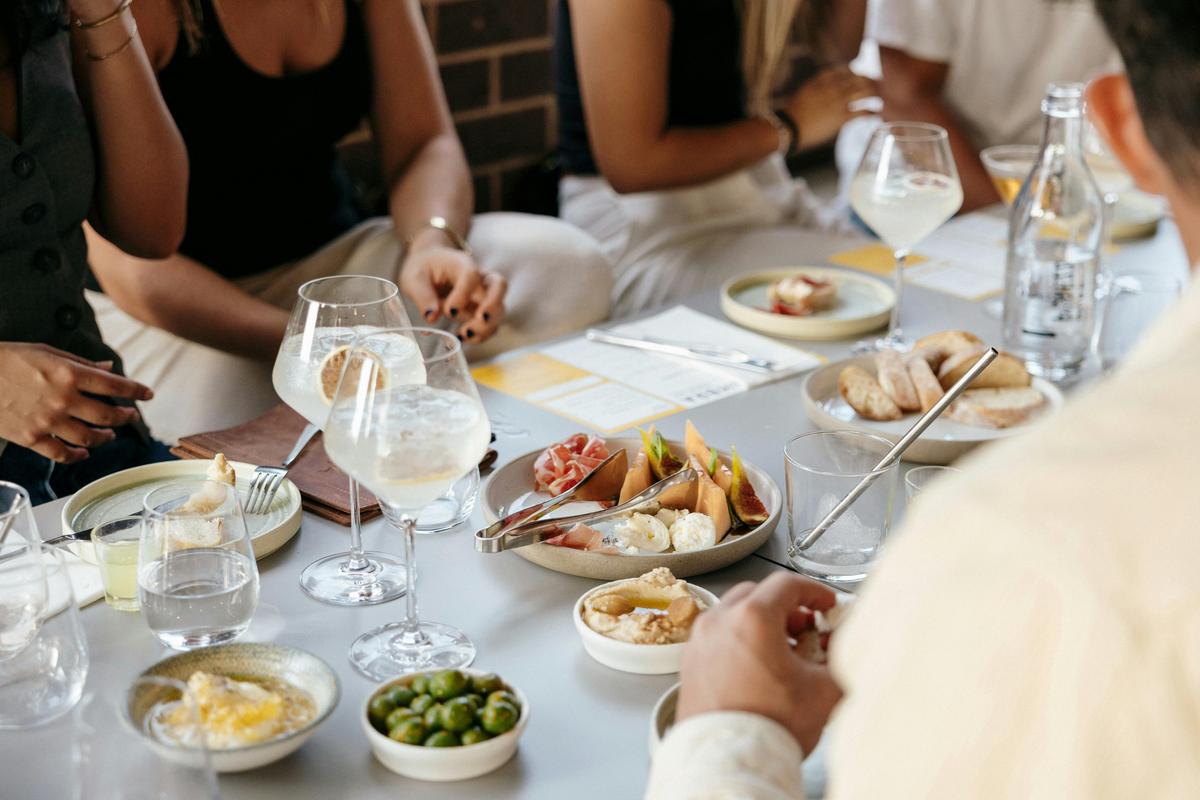 Table with shared snack plates and limoncello spritz
