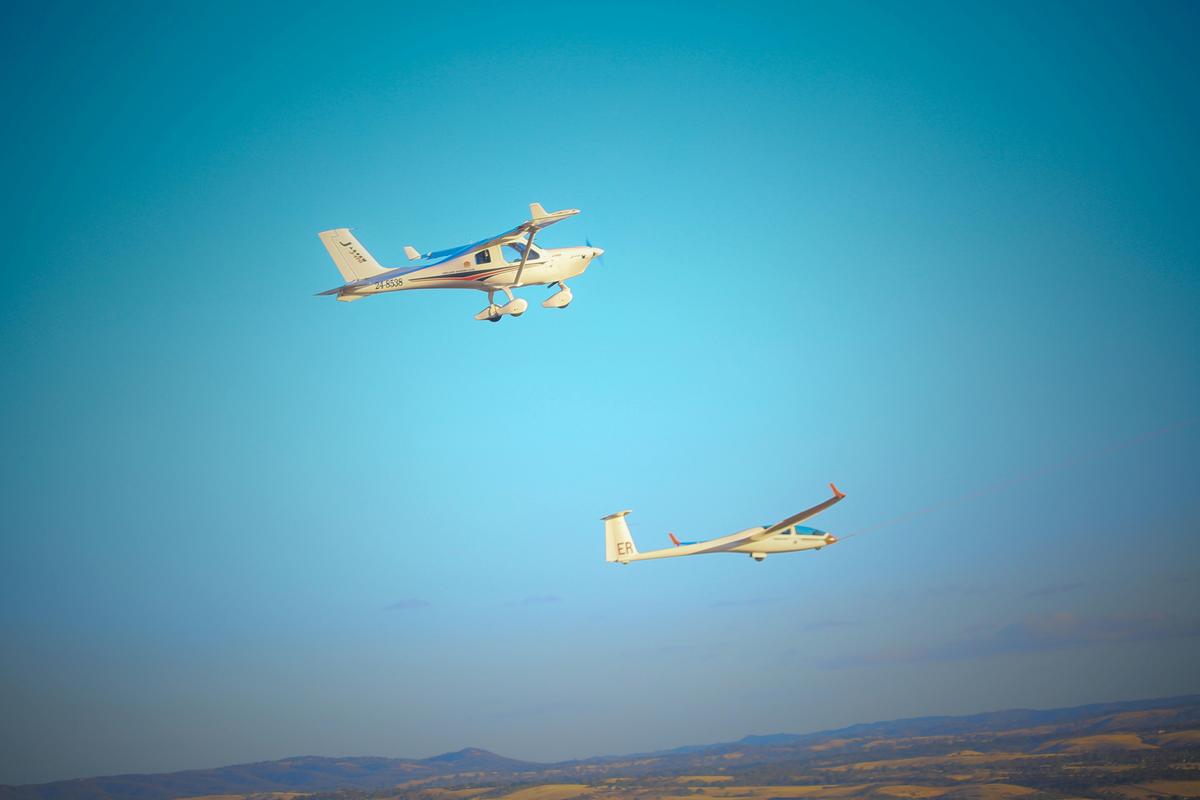 Glider flying next to a Light Sport Aircraft