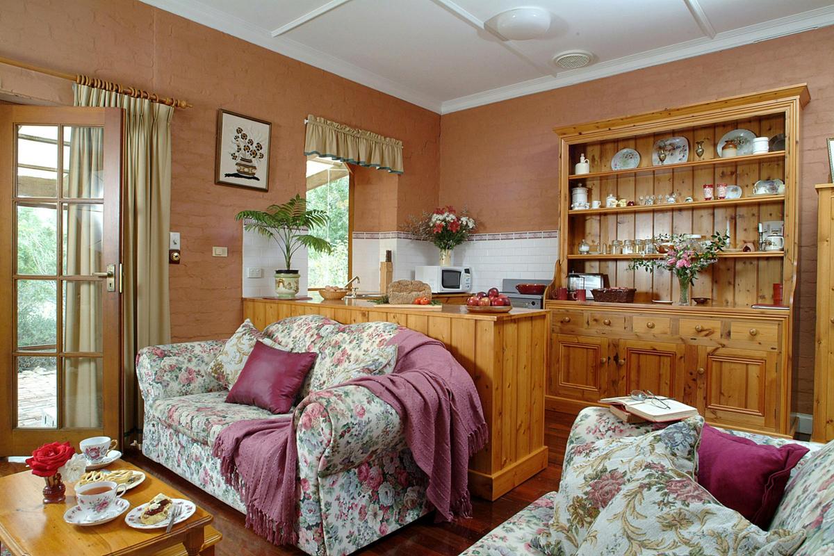 The kitchen/dining/living area features the sideboard made from original 1899 timber.