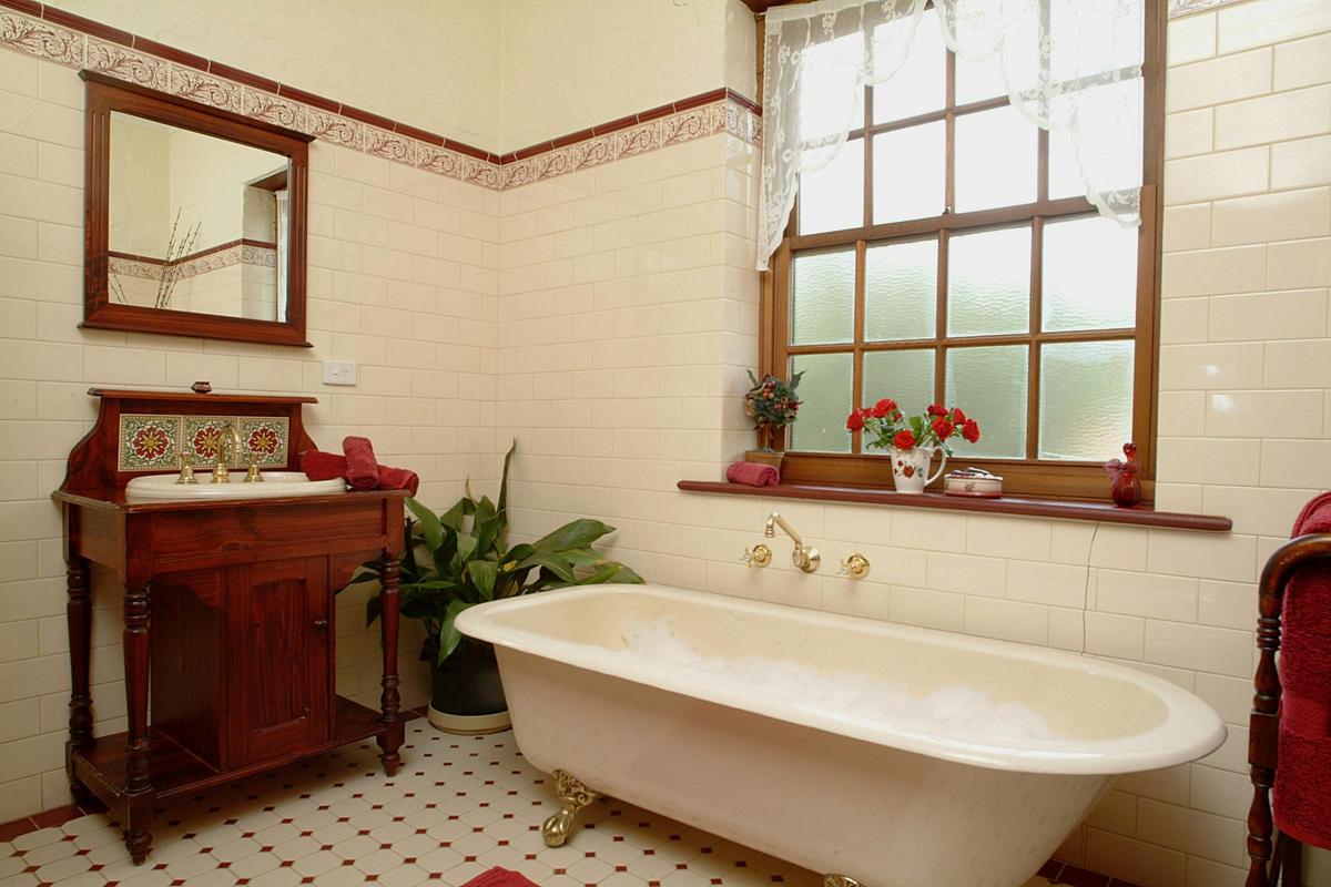 Large claw footed bath with a separate shower