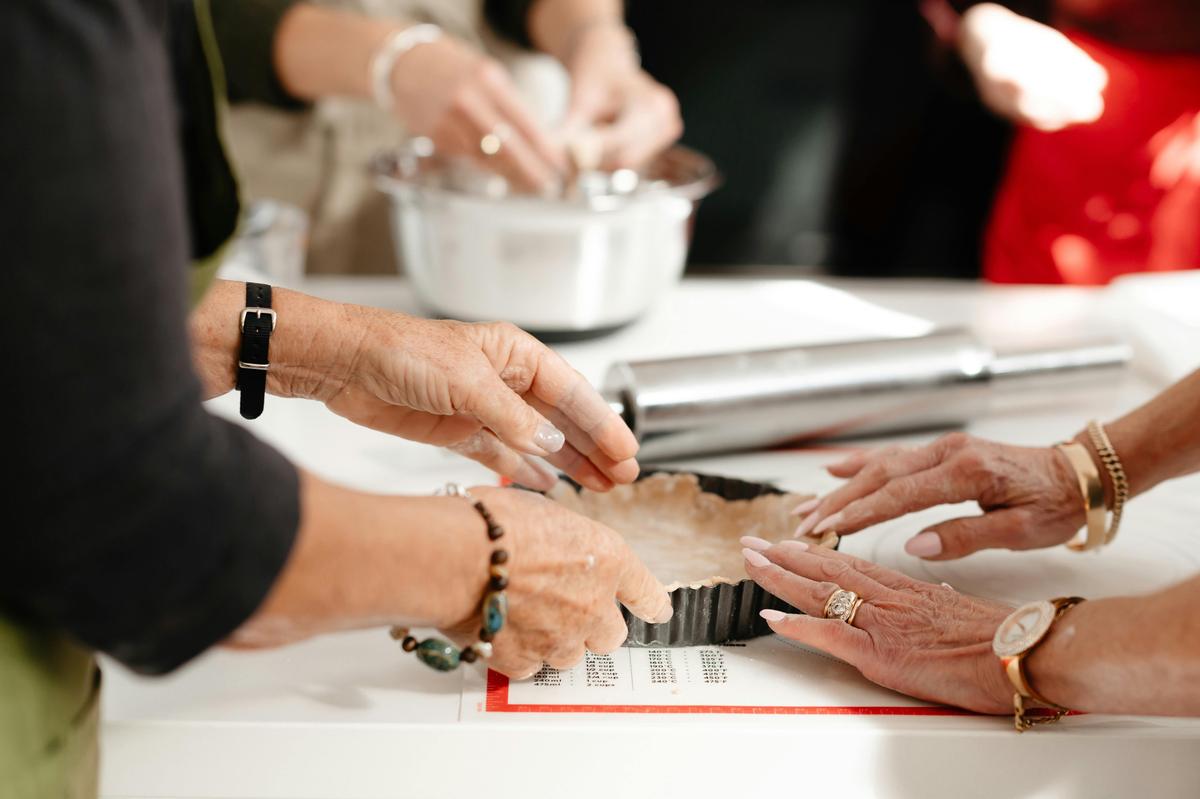 Working together to create delicious pastries in a hands-on cooking class