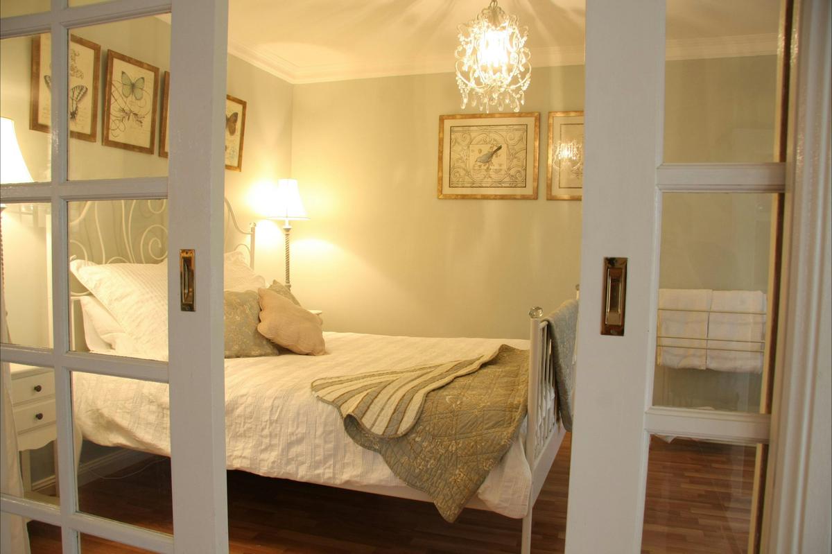 Bedroom 4 with vineyard views and French doors.