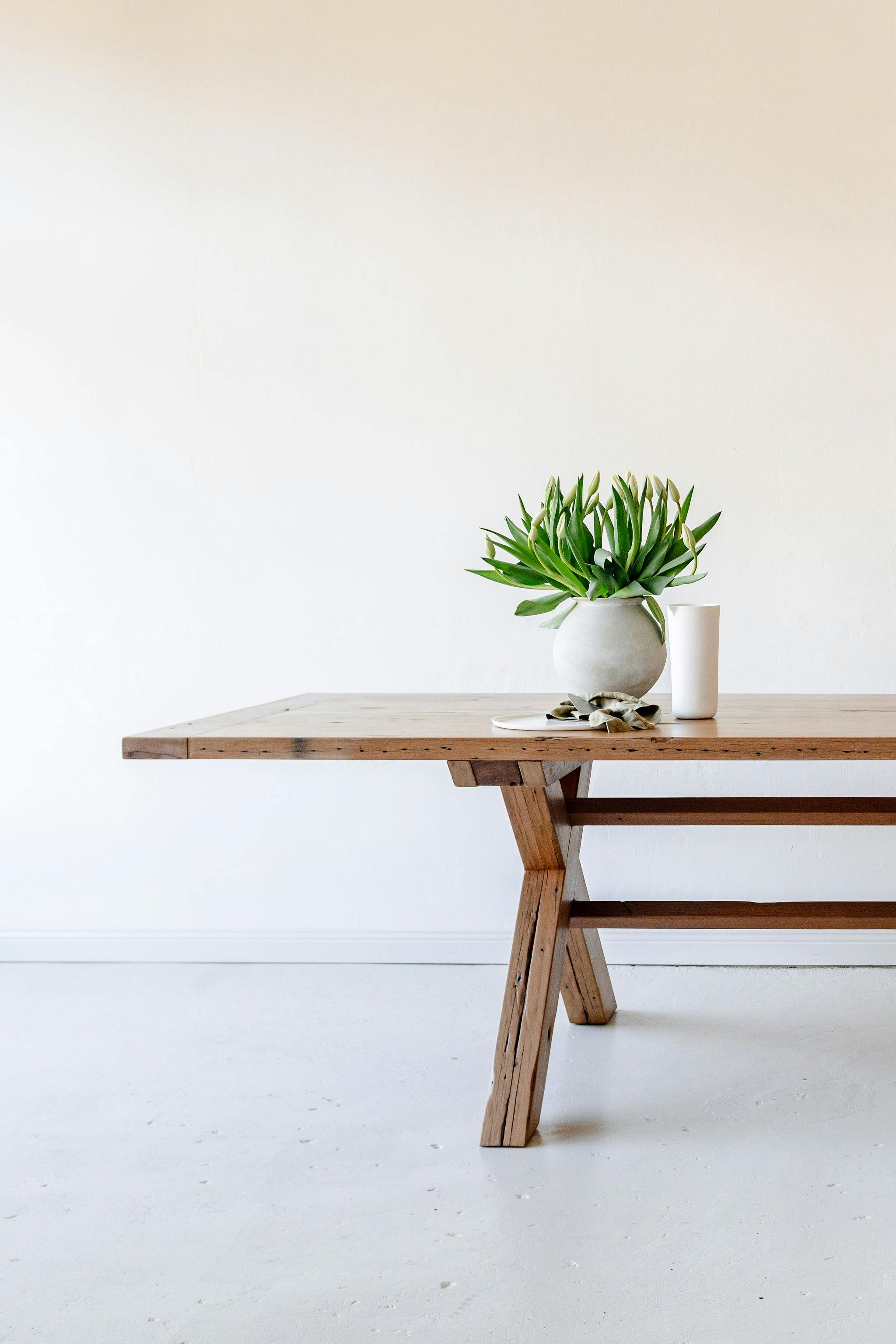 Peggy cross leg dining table made from reclaimed Australian hardwood sourced from Huskisson NSW.