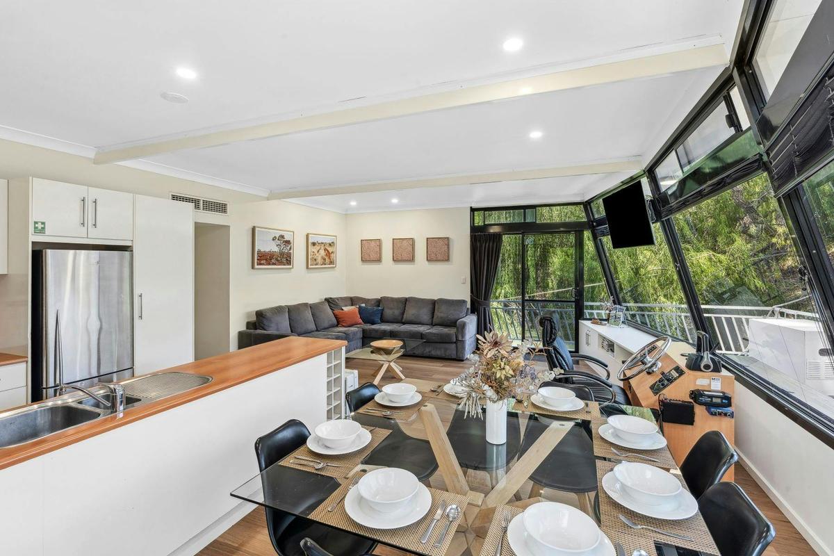 Spacious kitchen, living and dining area with 8 person dining table