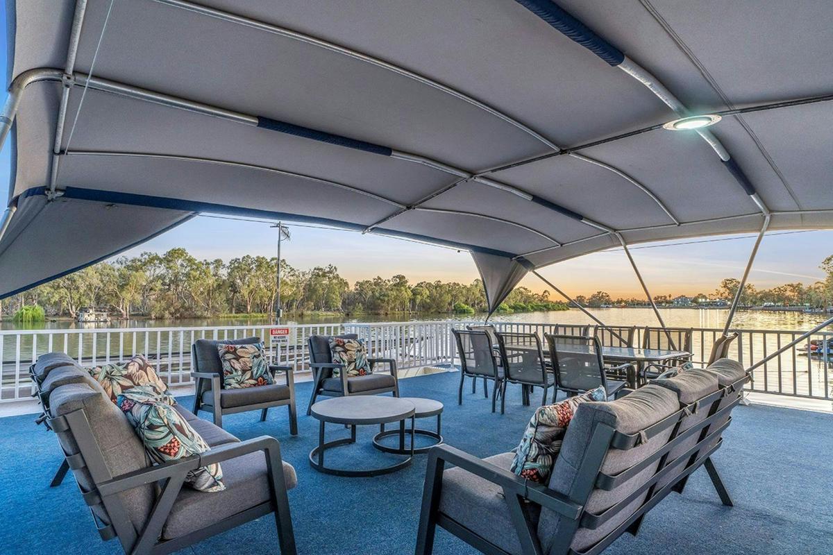 Spacious top deck with 8 seats outdoor lounge and table