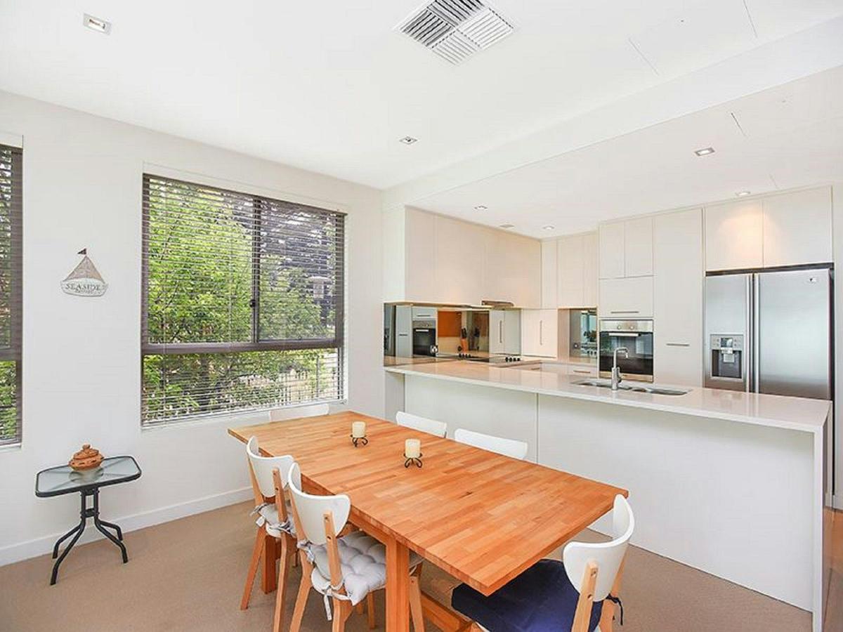 Well-appointed for cooking and dining, whether preparing family meals or enjoying local takeaway.