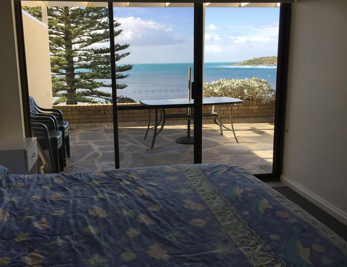 Master bedroom with sea views and deck access