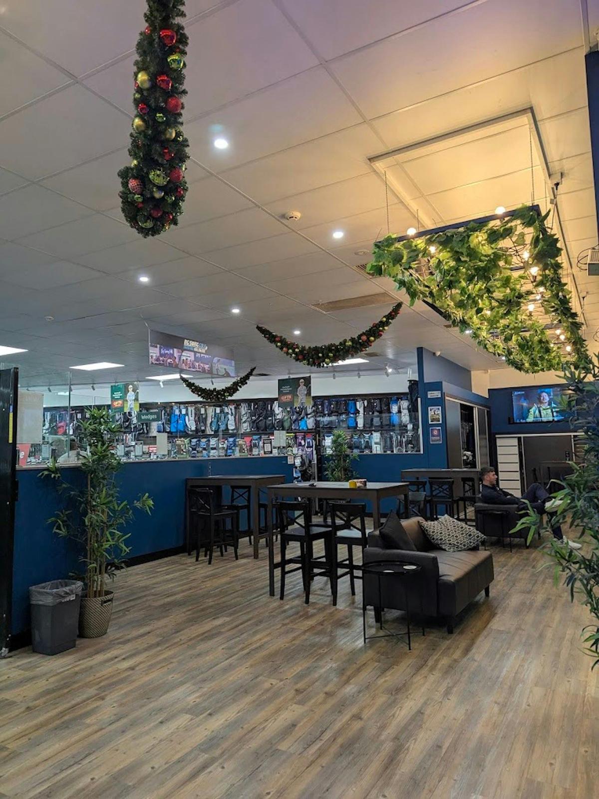 a photo of our seating area and room that we have for functions. this includes couches and tables...