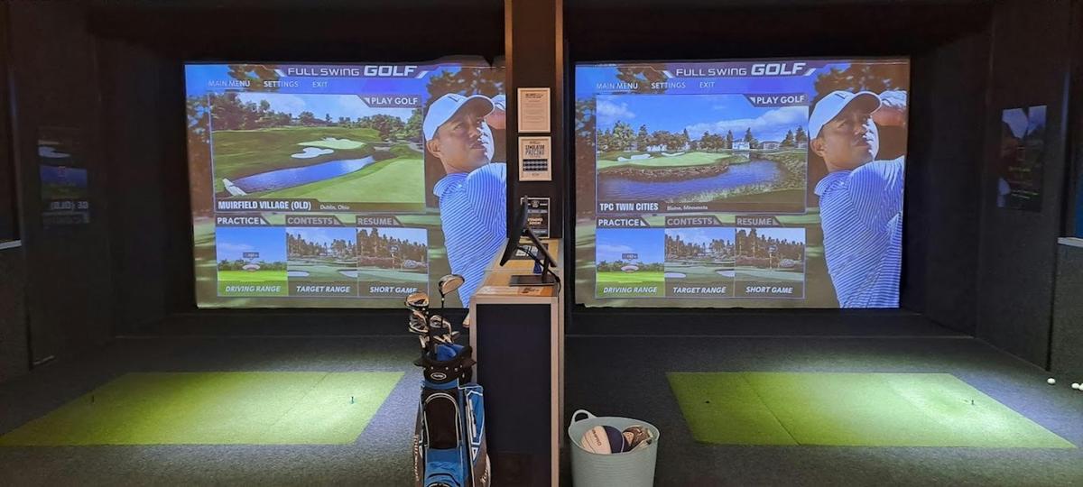 photo of 2 simulators next to eachother, showcasing our full swing software and seating area forgolf