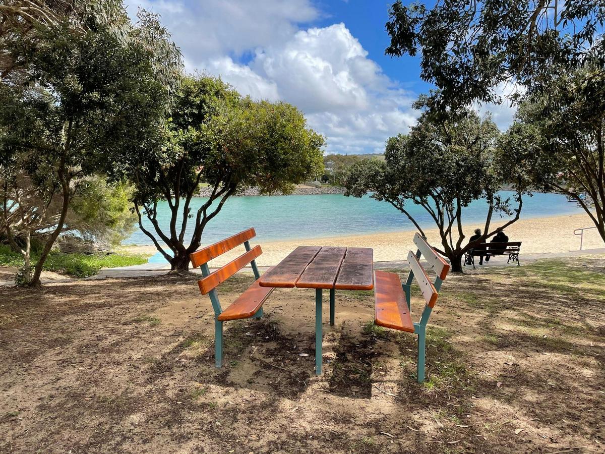 Picnic table close to the beach and lake