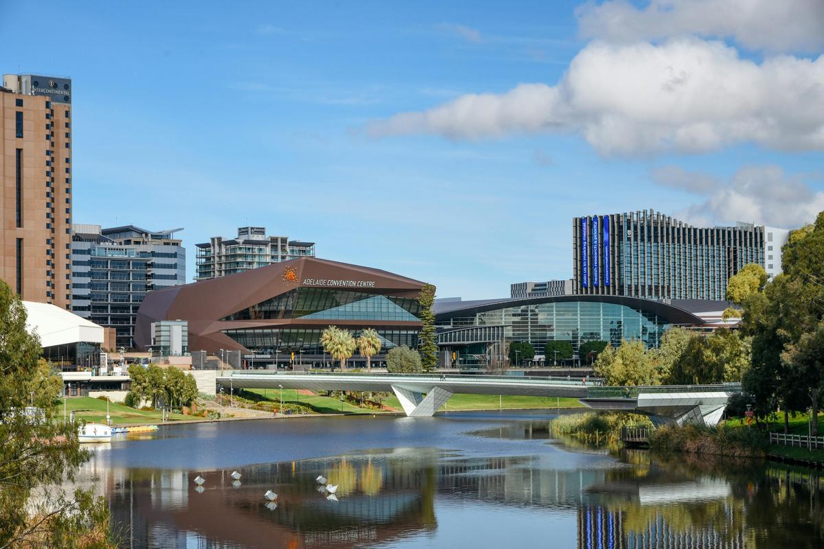 A view of a river landscape with Adelaide city in the background