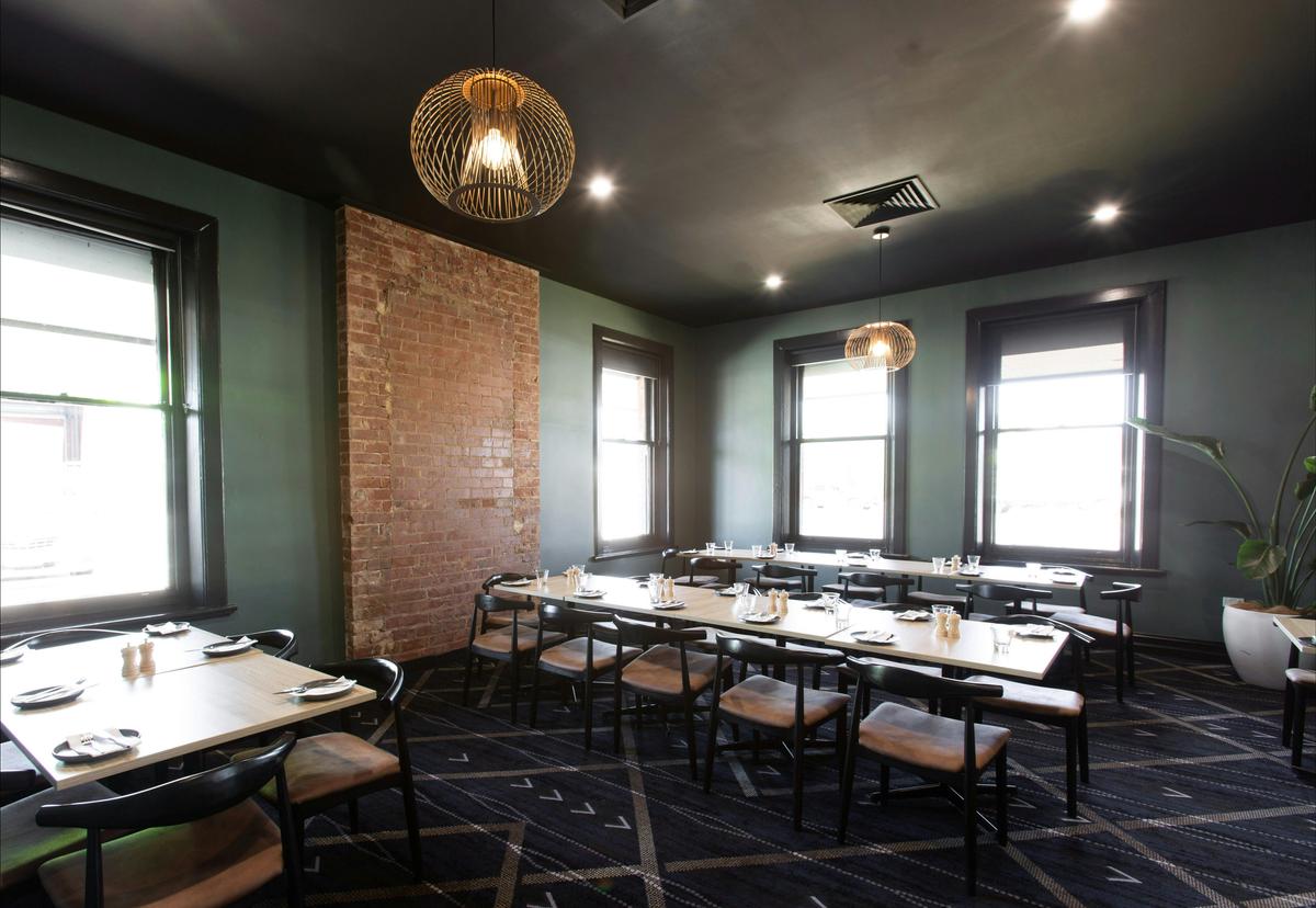 The dining area at the Cross Keys Hotel offers a relaxing space to enjoy delicious food and drinks.