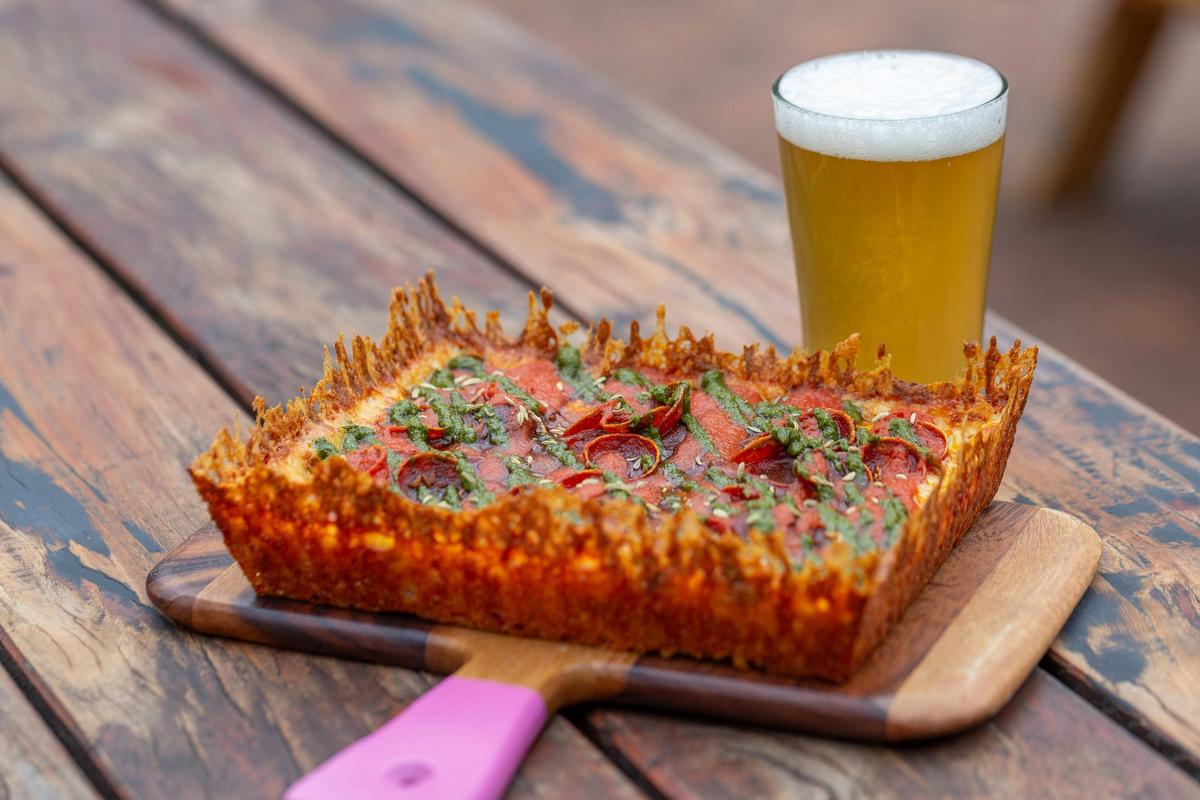 Refreshing "Sir-Veza" Lager paired with the Ol' Smokey' Pizza