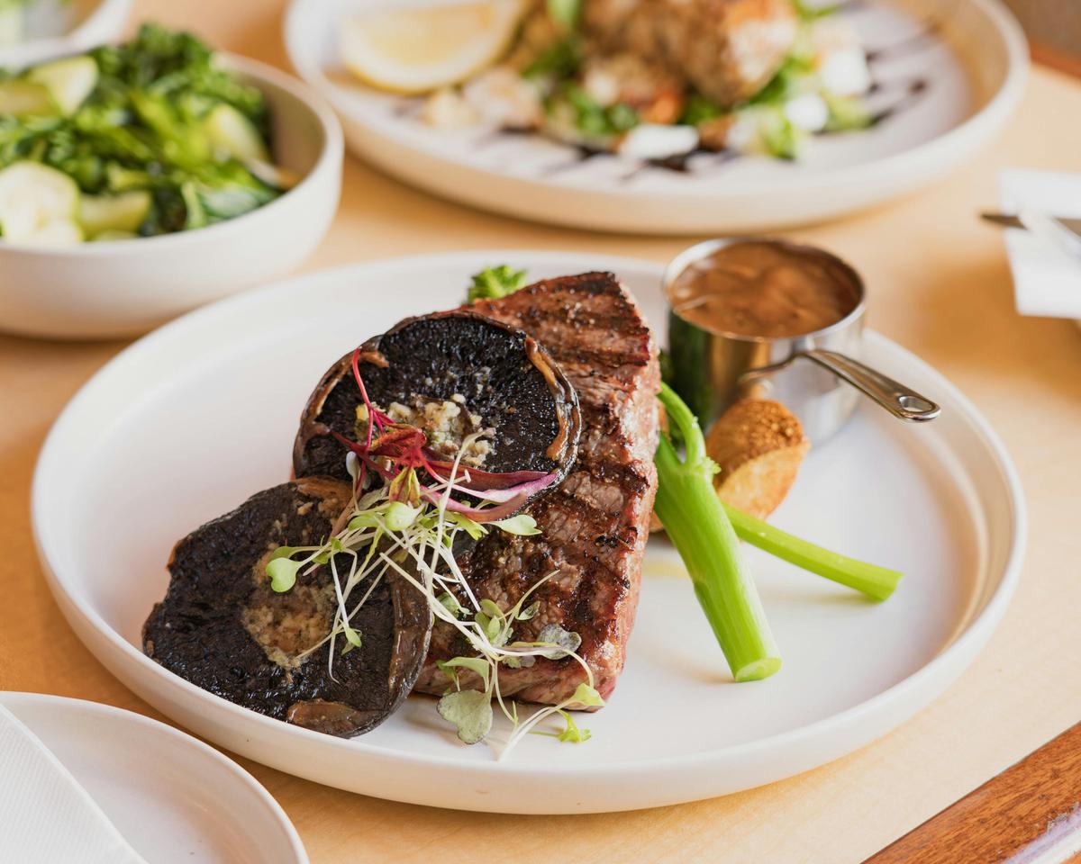 Savor the flavors of a perfectly grilled steak in the Criterion Tavern’s dining area.