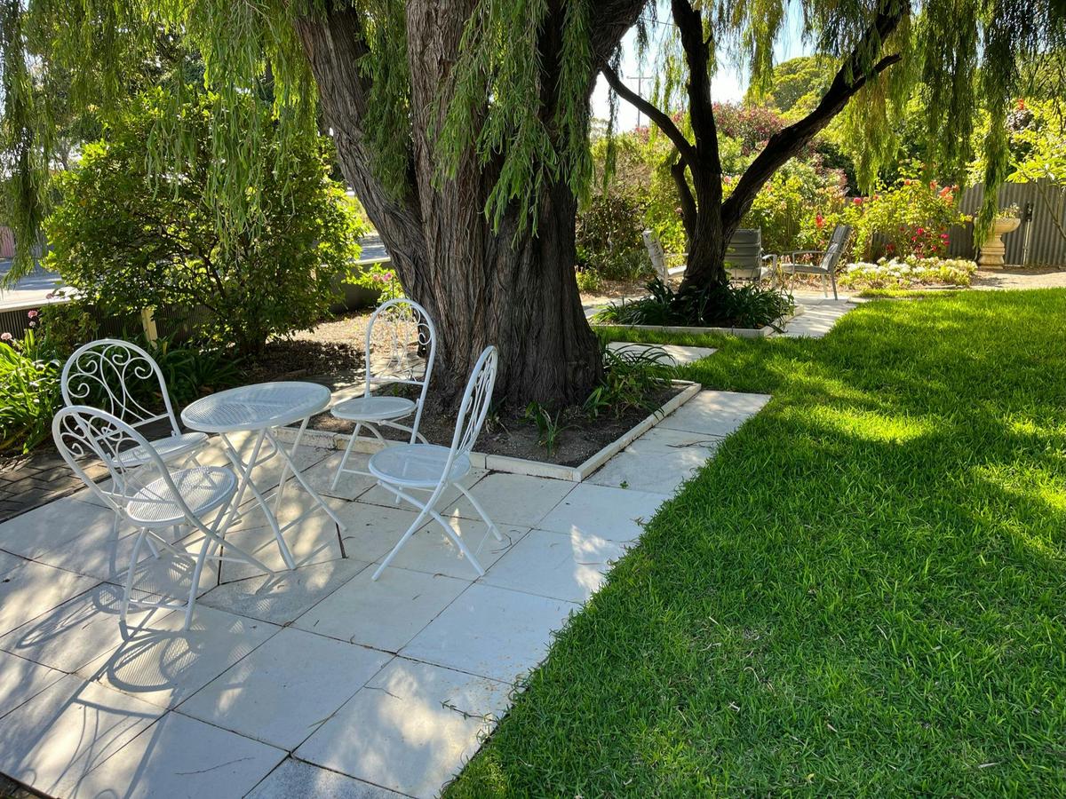 Relax in the garden while watching the world go  by with friends sipping divine G&Ts